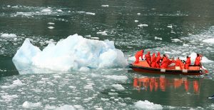 Boaters by a Glacier