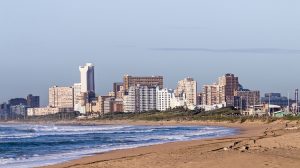 beach with a building skyline