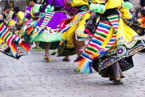 Waist down view of Peruvian dancers at a parade in Cusco