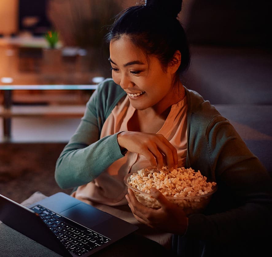 Asian-young-adult-woman-eating-pop-corns