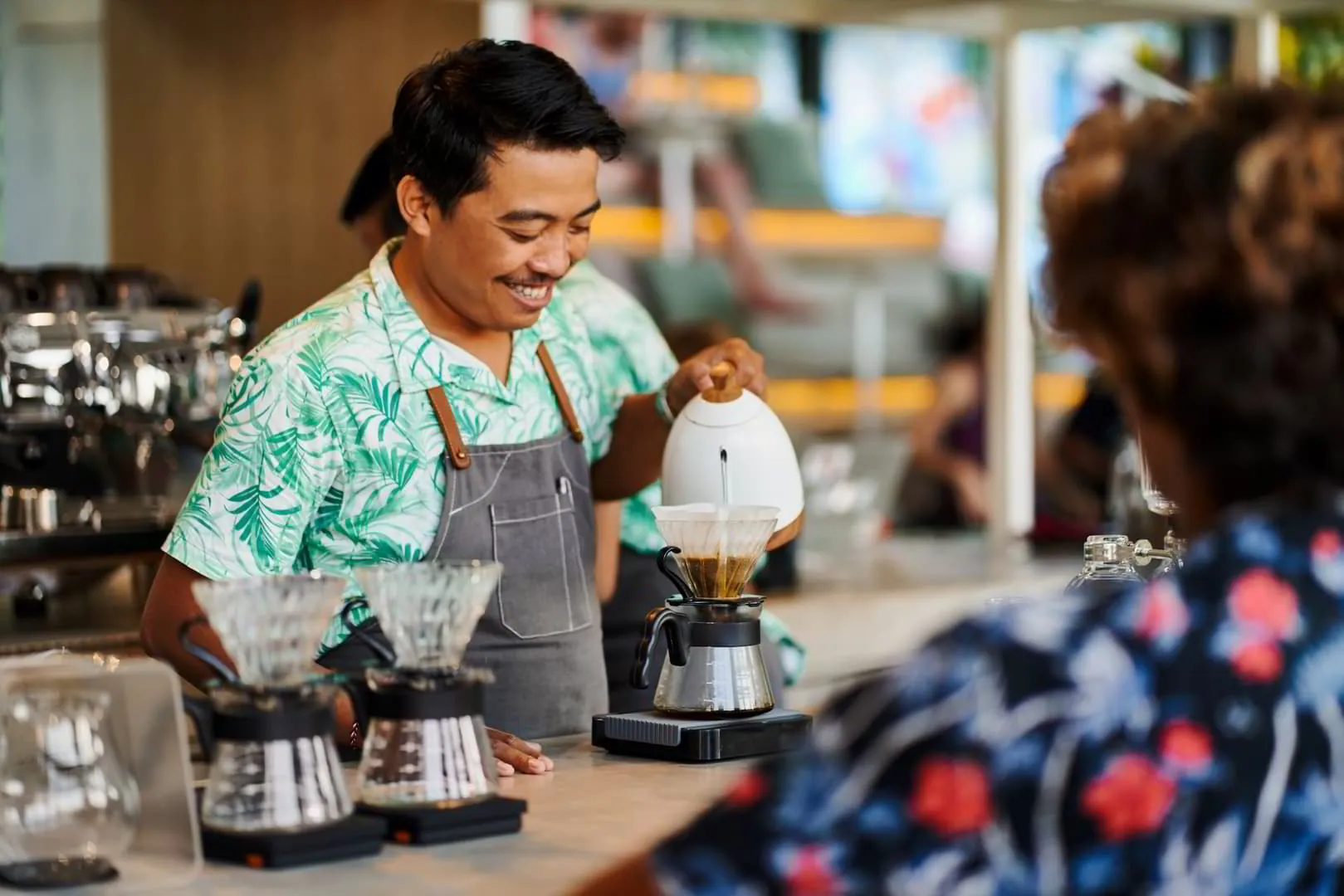 Asian man working at coffe shop as a barista