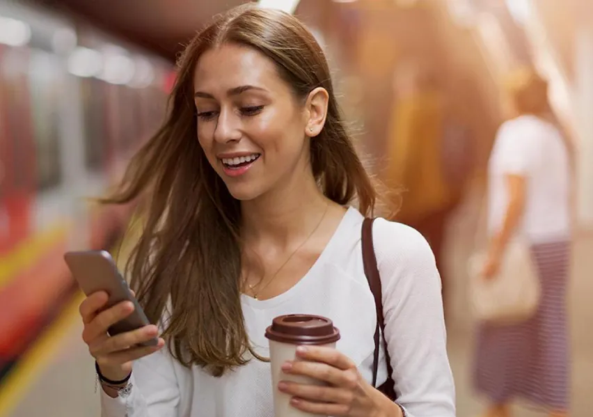 woman_phone_coffee_train