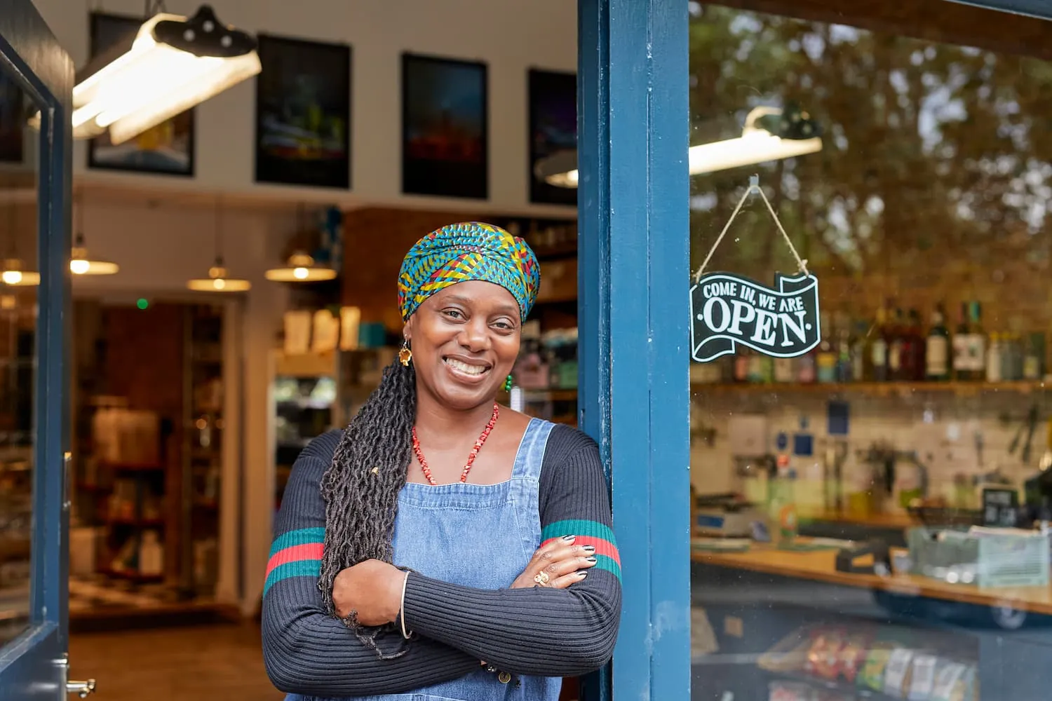 African american women standing in local shop doorway