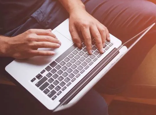 sitting_on_sofa_with_laptop-1